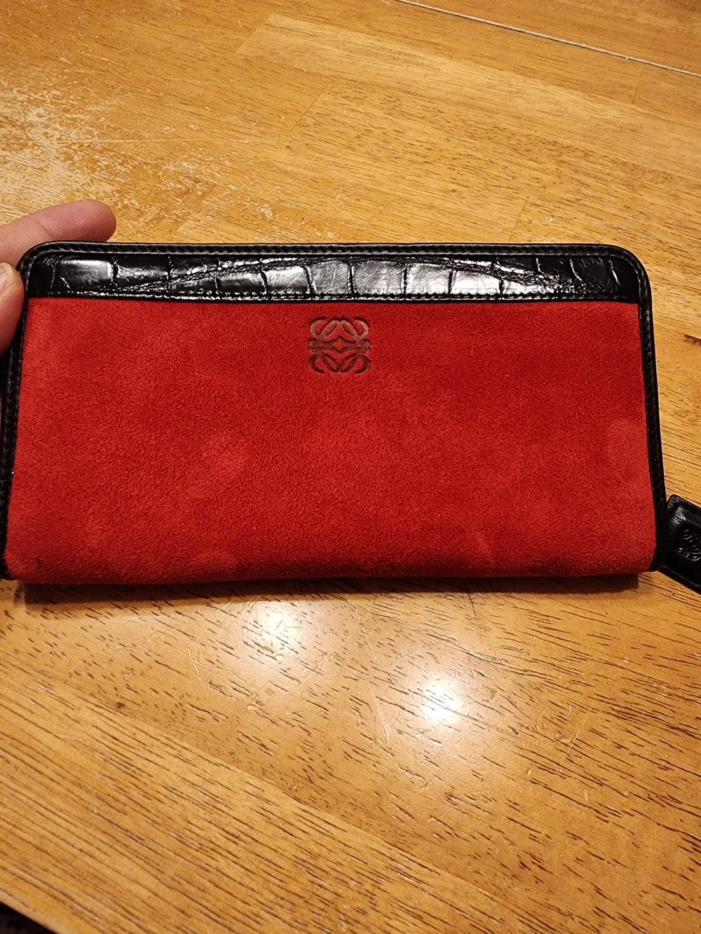 Loewe wallet features  vibrant red suede body & black crocodile Embossed Leather